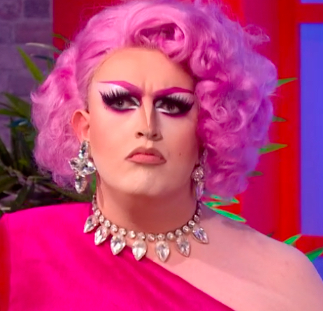 Lawrence Cheney looking like a whole cavity in this sickly sweet Peppa Pig pink sugar cube encrusted daytime TV ensemble.